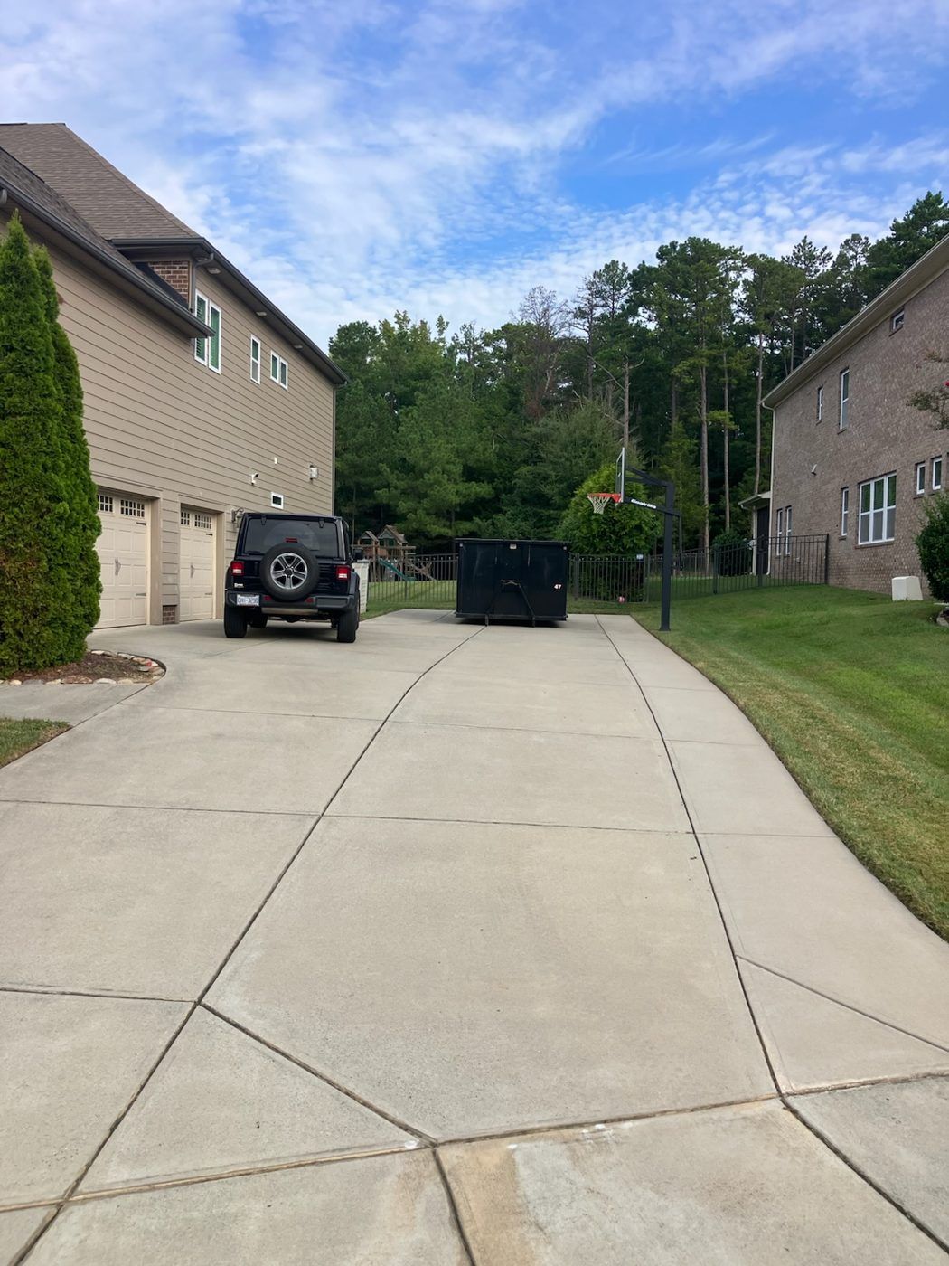 20-yard Snappy roll-off dumpster in a Monroe, NC driveway