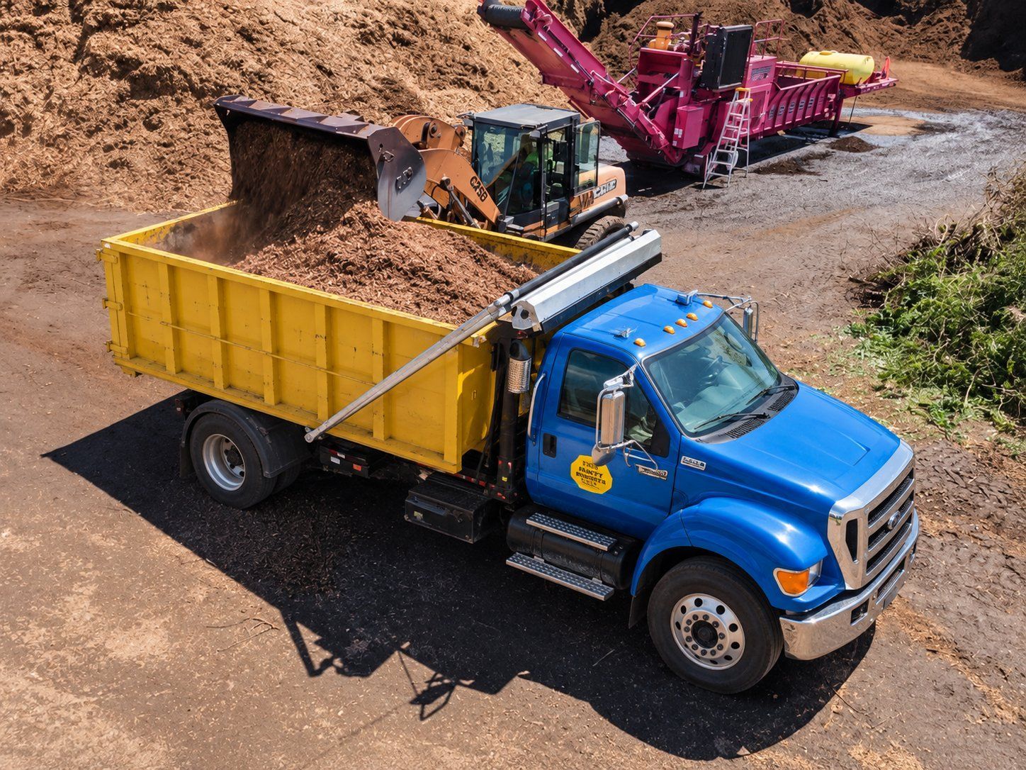 Snappy Dumpster Rental truck being loaded with county mulch at the Mecklenburg County mulch depot in Charlotte NC