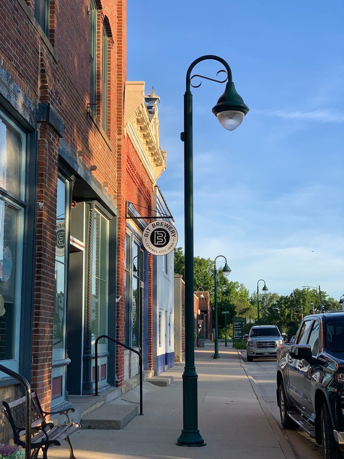 A street with a sign that has the BIT Logo on the building