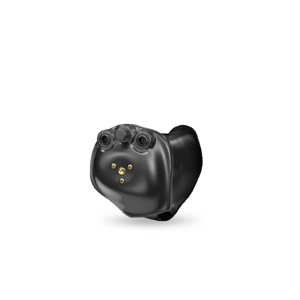 A black hearing aid is sitting on a white surface.
