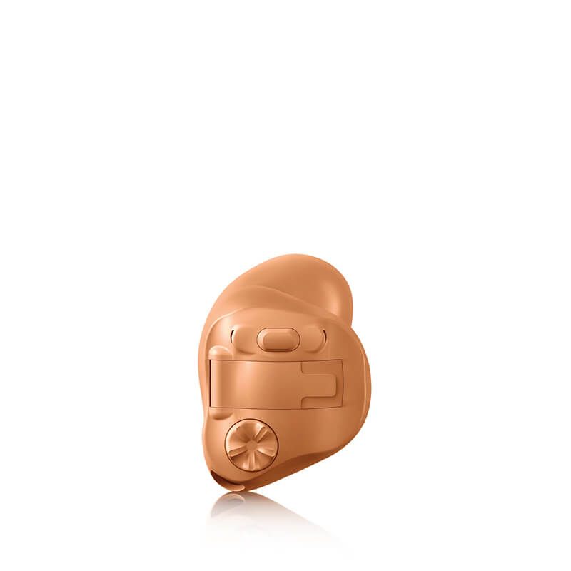 A close up of a hearing aid on a white background.