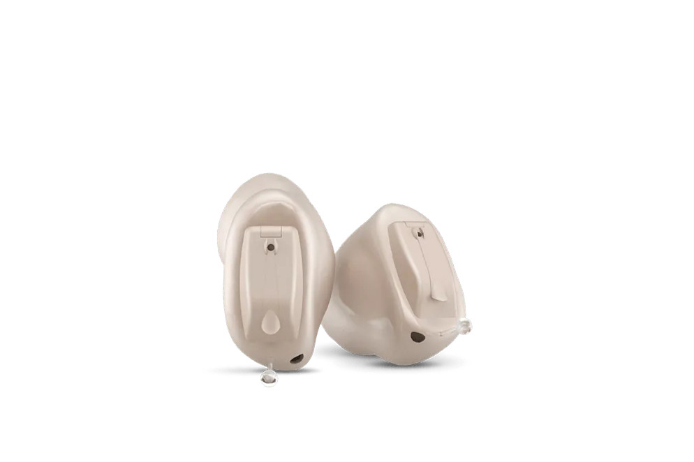 A pair of hearing aids on a white background.