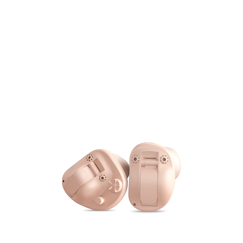 A pair of hearing aids on a white background.