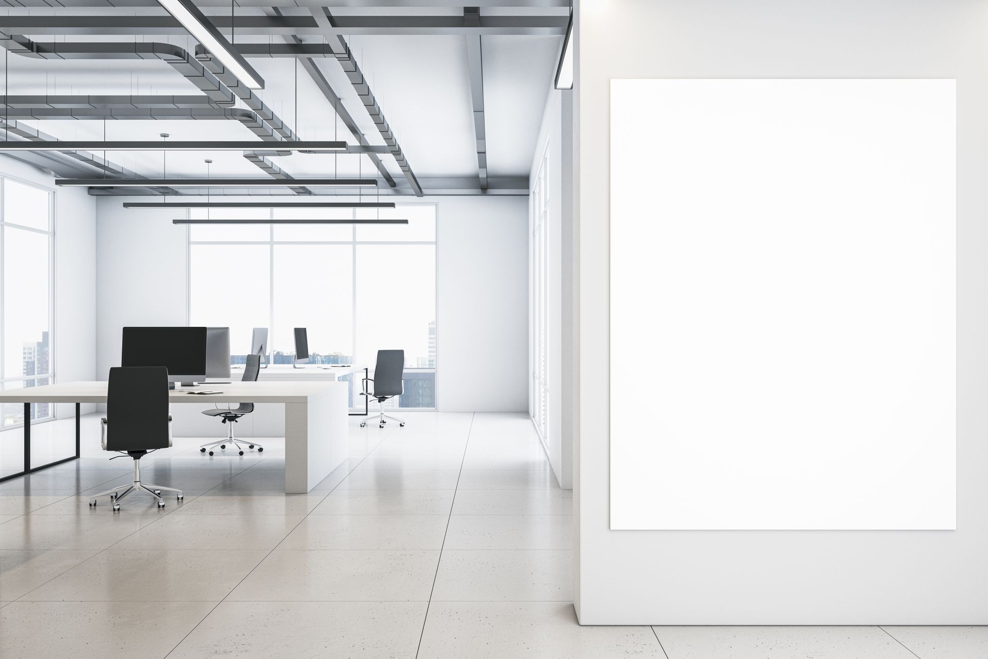 Minimalist modern office with desks, chairs, and bright white walls