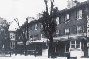 An old black and white photo of a hotel