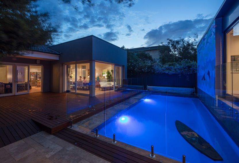 Backyard at Dusk With Illuminated Pool and Modern House — Burmah Constructions In Kangaroo Valley, NSW