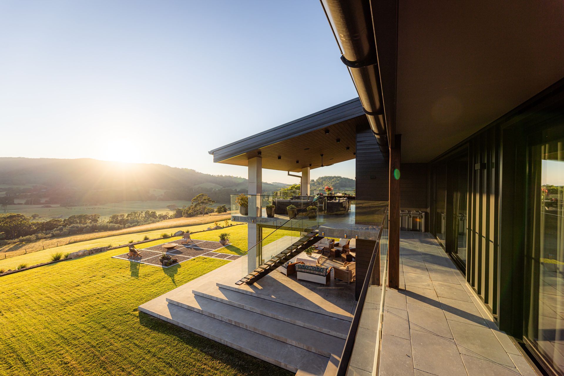 Sunlit House Deck Overlooking a Grassy Hillside and Valley — Burmah Constructions In Kangaroo Valley, NSW