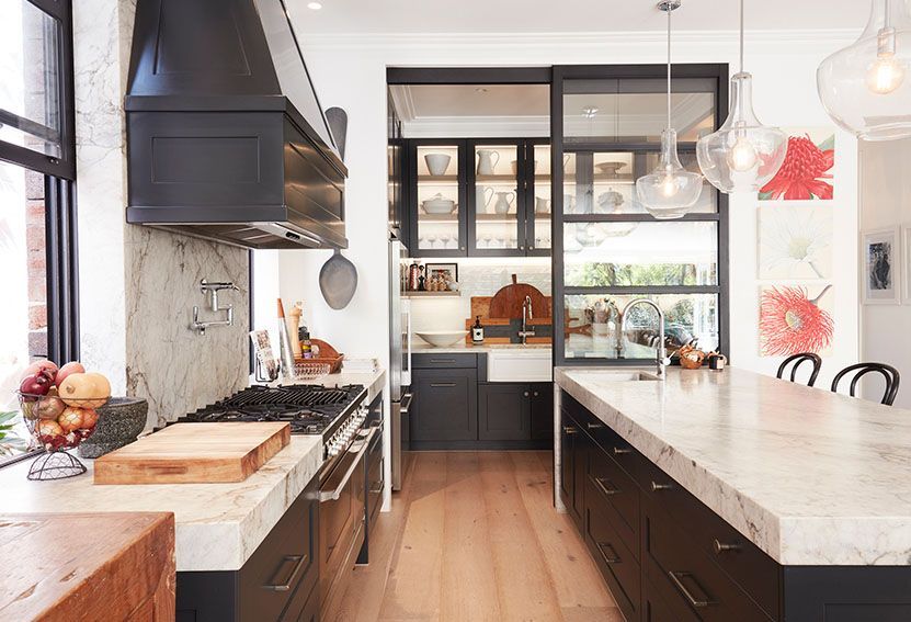 Modern Kitchen With Dark Cabinetry Marble Countertops — Burmah Constructions In Kangaroo Valley, NSW