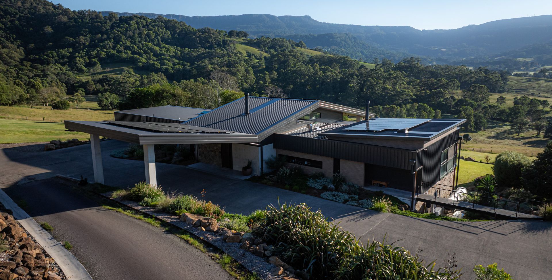 Modern House With Solar Panels on a Hillside — Burmah Constructions In Kangaroo Valley, NSW