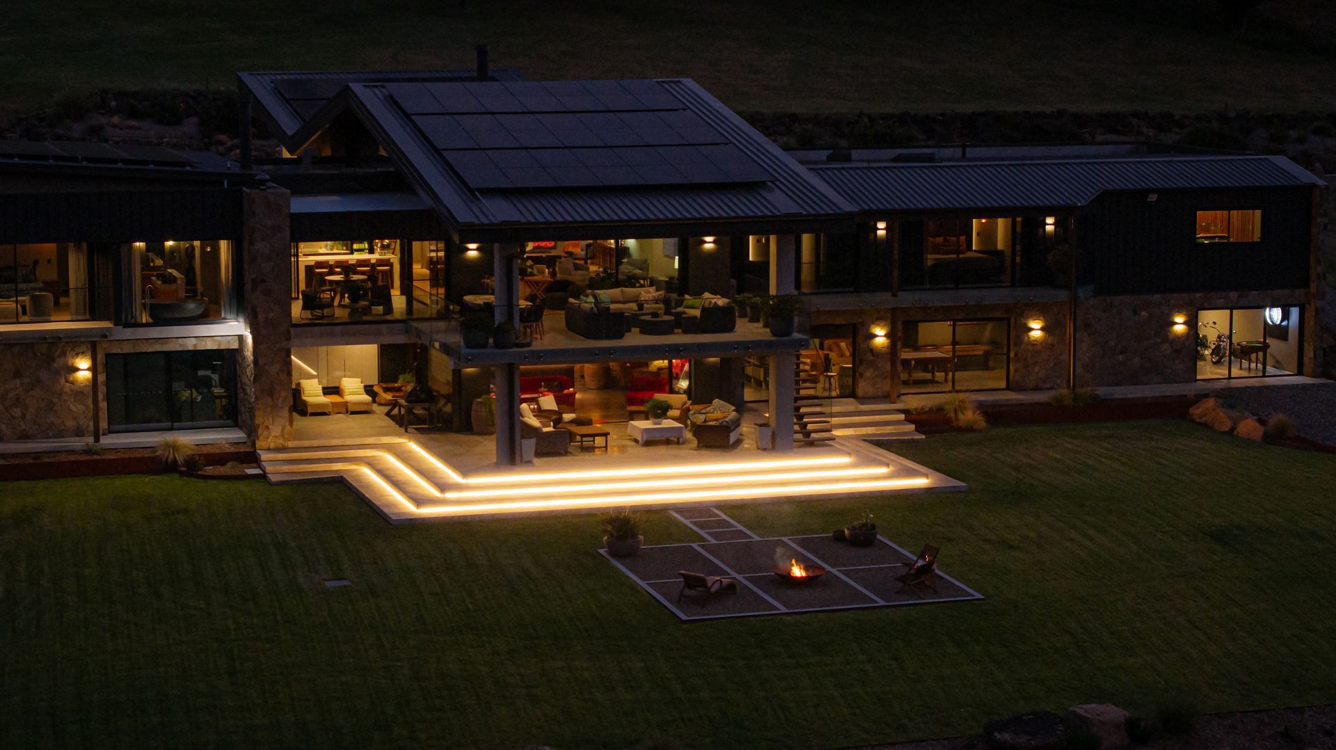 Modern House at Dusk With Warm Lights and Illuminated Steps — Burmah Constructions In Kangaroo Valley, NSW