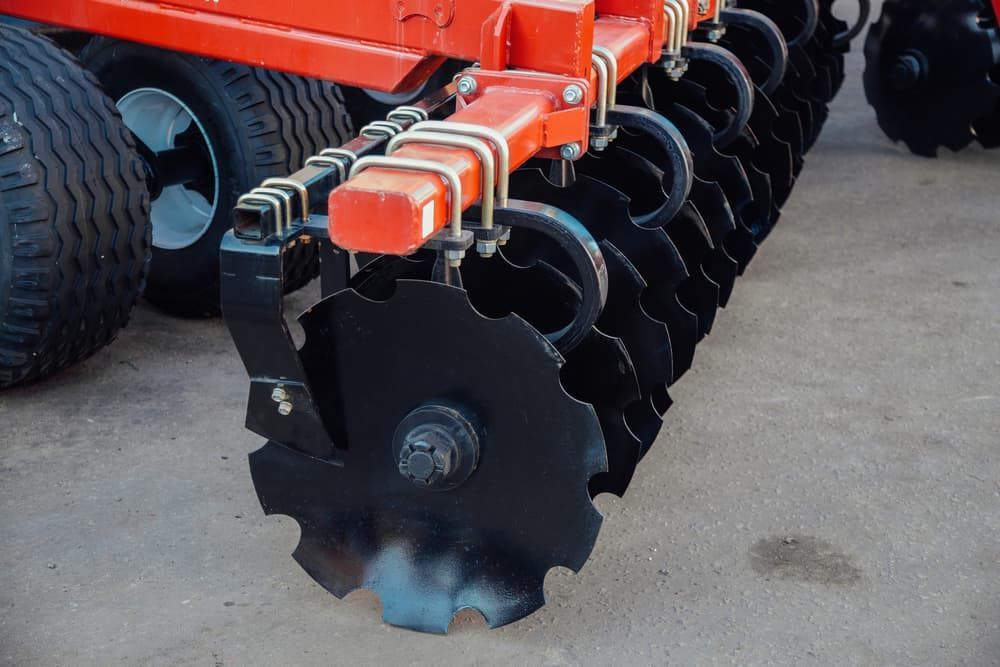 A Close up Of a Disc Harrow on A Tractor — Thompson's Farm Gear In Taree, NSW