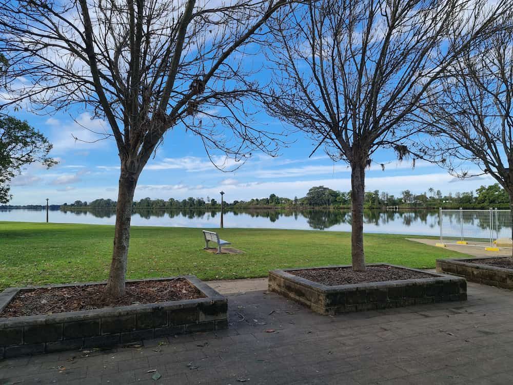 A Park with Trees and A Lake in The Background — Thompson's Farm Gear In Taree, NSW