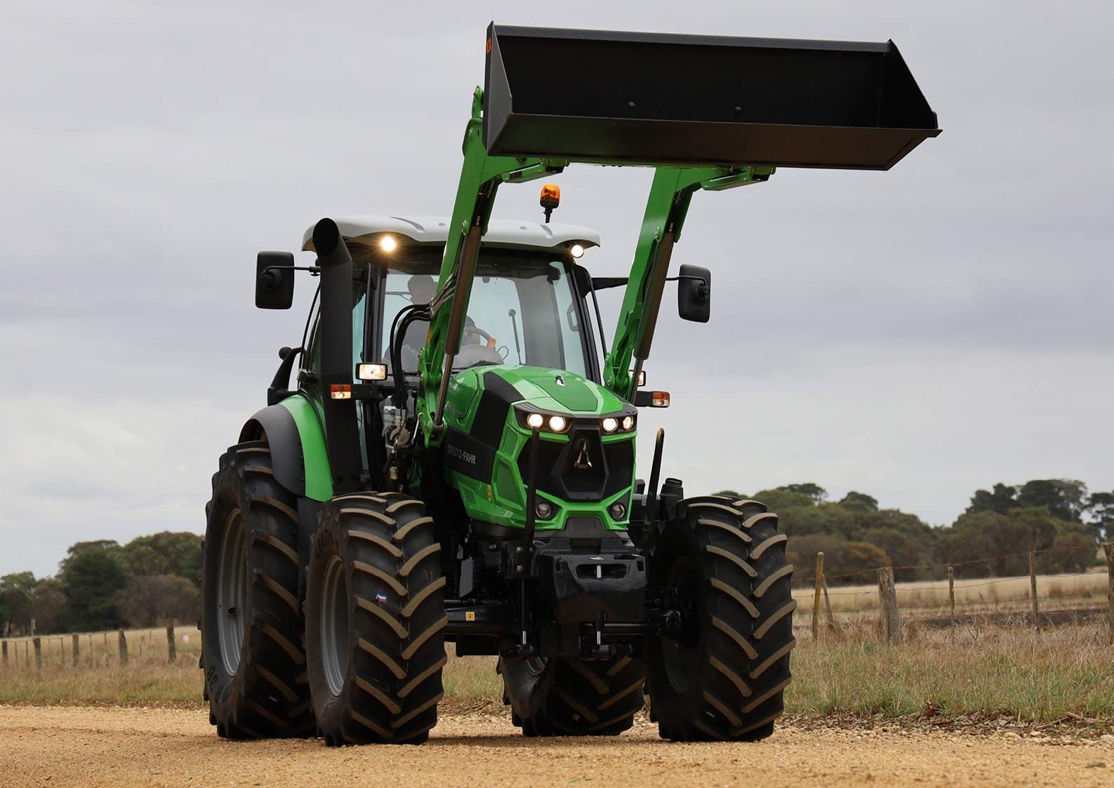 Deutz Fahr Tractor Equipped with Bucket Attachment — Thompson's Farm Gear In Port Macquarie, NSW