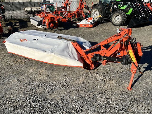 A Tractor and A Mower Are Parked in A Gravel Lot — Thompson's Farm Gear In Port Macquarie, NSW