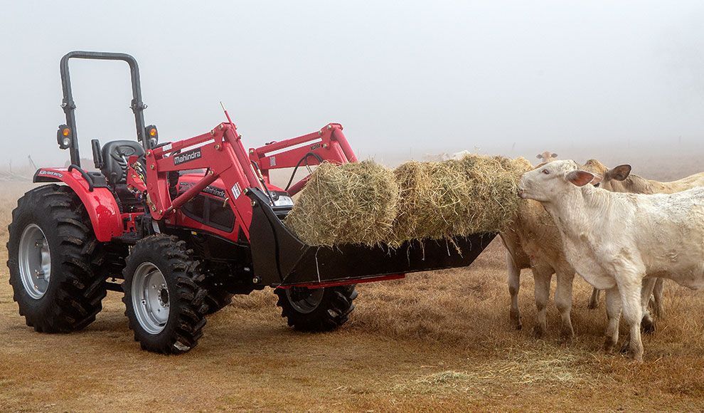 Farmer Seeding Crops with Tractor in Agricultural Field — Thompson's Farm Gear In Wingham, NSW