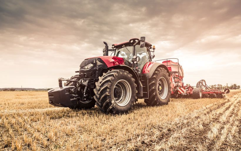 Modern Red Tractor Seeding Directly into Stubble with GPS-Equipped Red Equipment — Thompson's Farm Gear In Taree, NSW