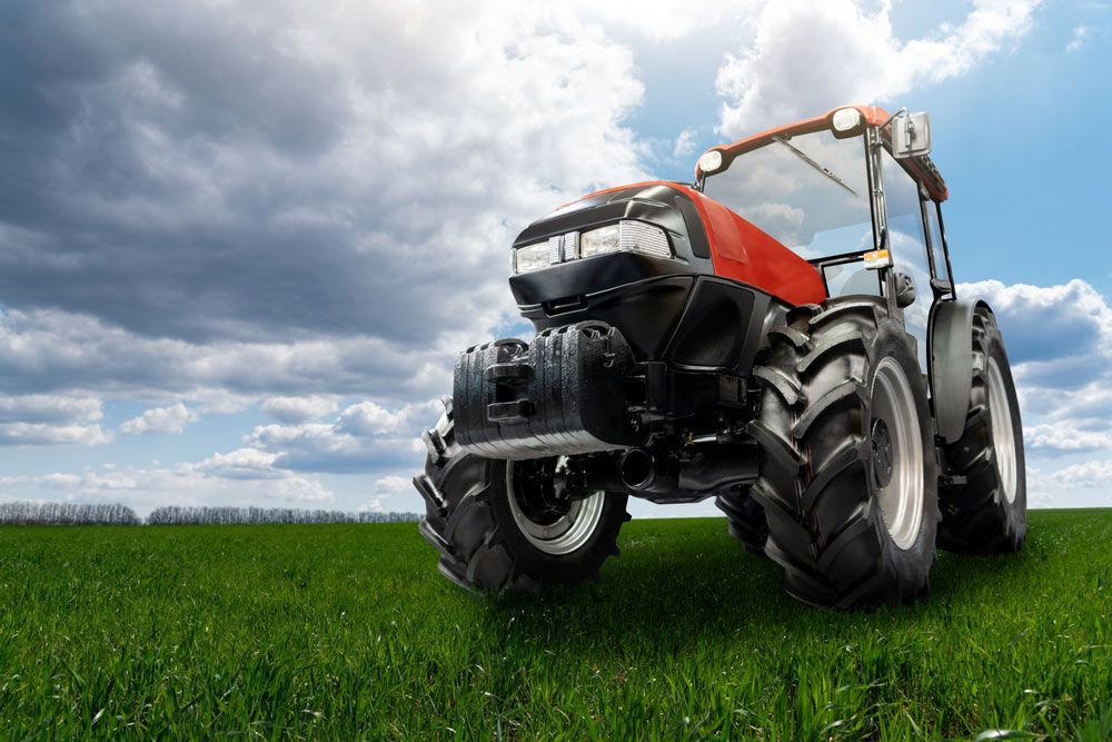 New Farming Machinery Tractor on Agricultural Land — Thompson's Farm Gear In Wingham, NSW