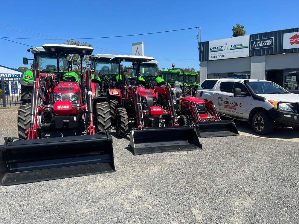 Row of Solis Tractors in Agricultural Setting — Thompson's Farm Gear In Port Macquarie, NSW