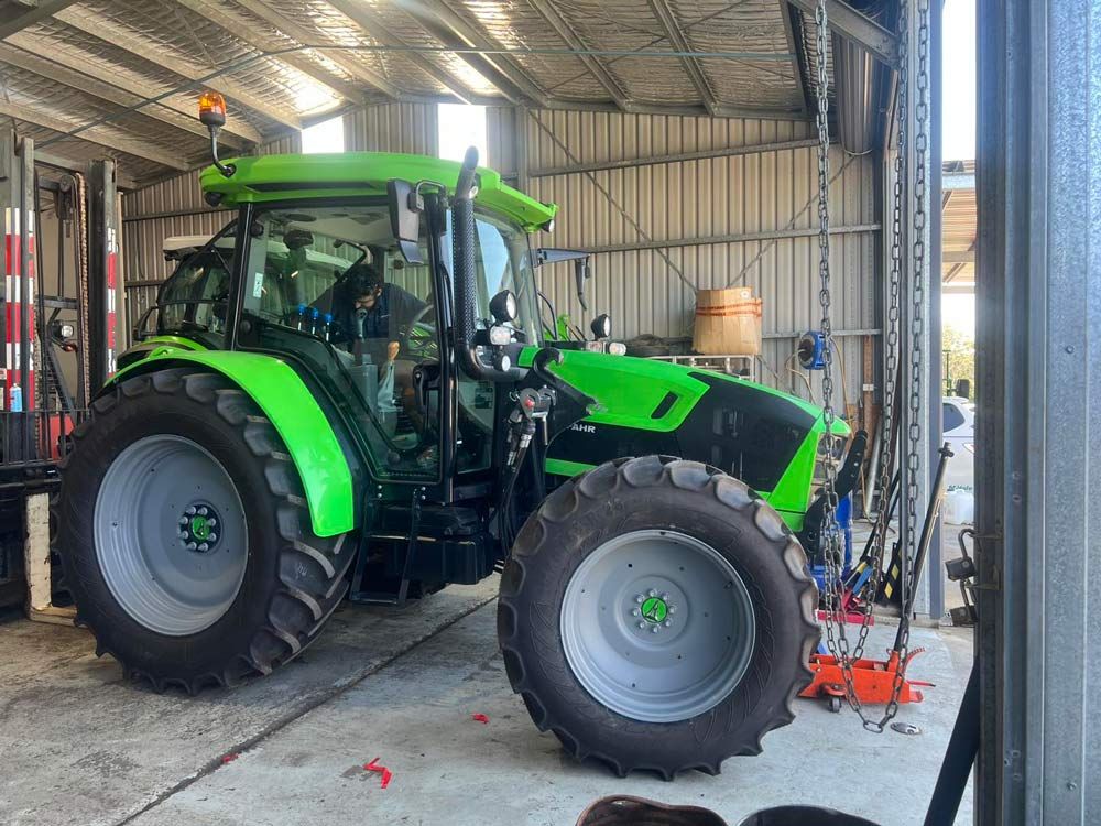 Expert Servicing for the Green Tractor — Thompson's Farm Gear In Port Macquarie, NSW