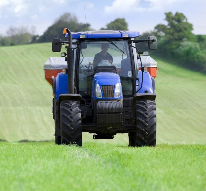 Farm Tractor Working in the Field — Thompson's Farm Gear In Wauchope, NSW