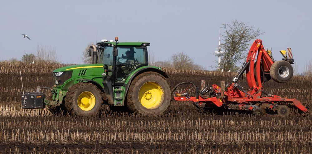 Red Tractor with Cultivator Attachment — Thompson's Farm Gear In Coffs Harbour, NSW
