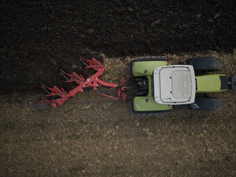 Tractor Speeding Across the Field — Thompson's Farm Gear In Wauchope, NSW