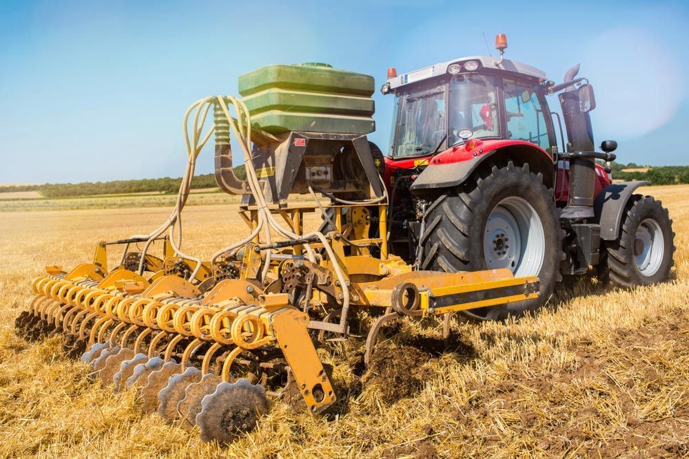 Harvested Barley Fields Being Plowed by a Tractor — Thompson's Farm Gear In Coffs Harbour, NSW