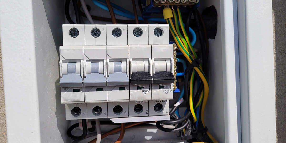 modern electrical panel with tripped breaker highlighted