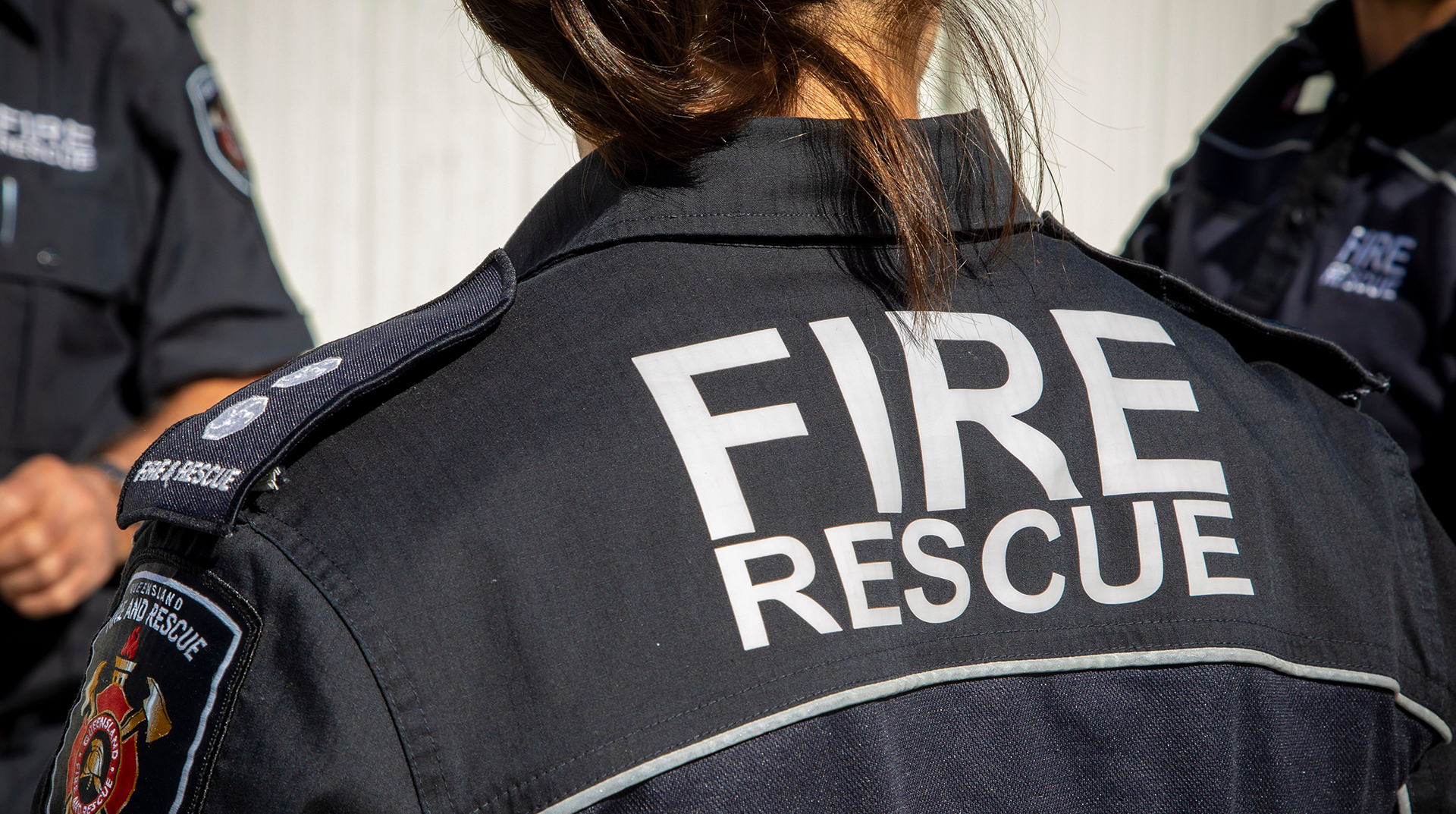 The back of a fire rescue officer 's jacket