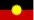 A yellow light is shining on a red and black background.