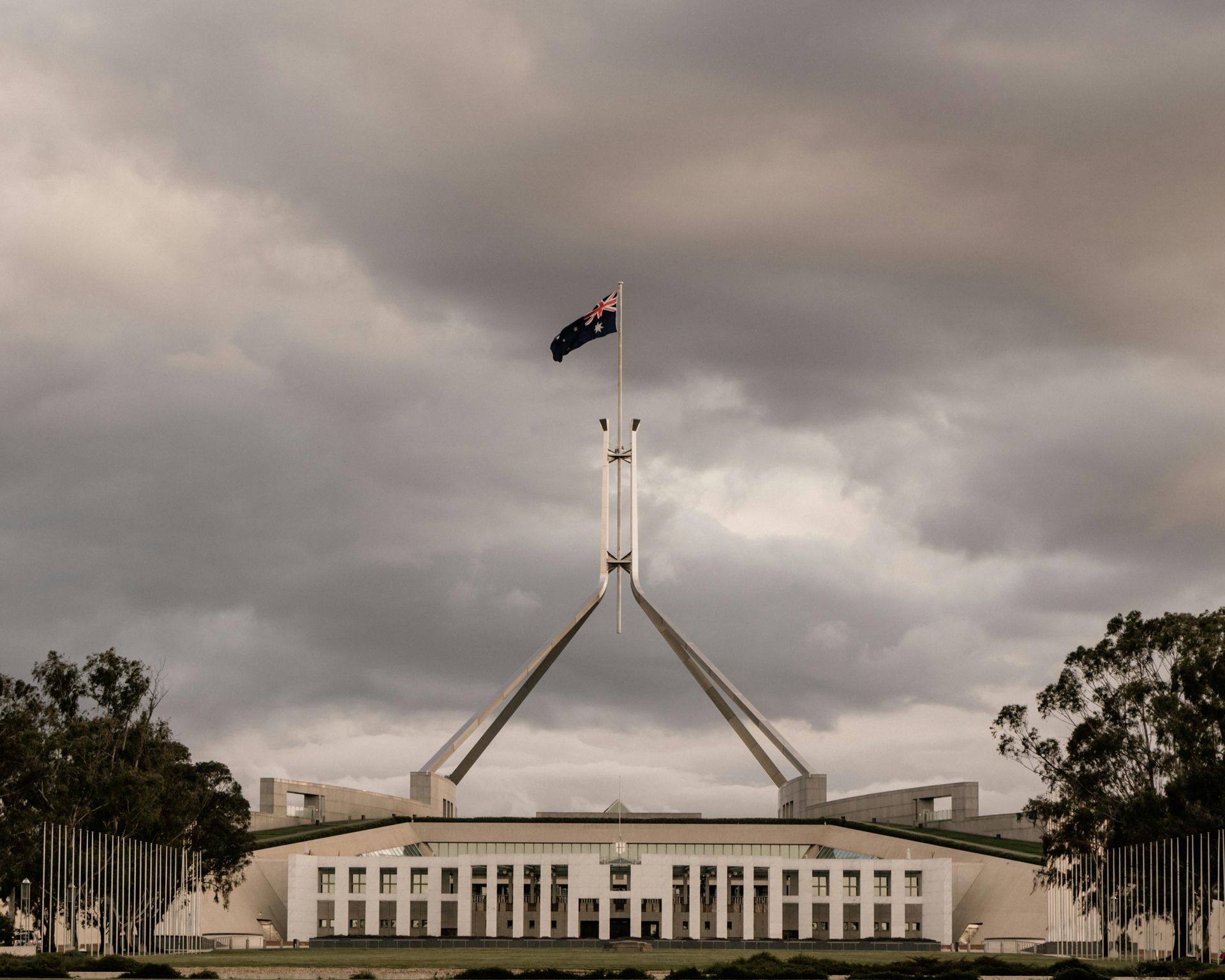 A large white building with a flag on top of it