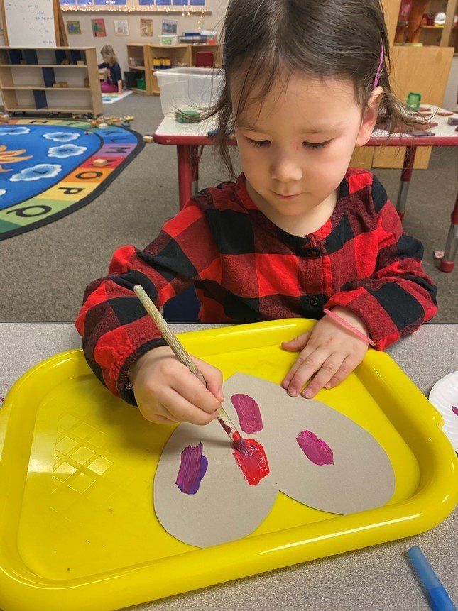 Preschooler Painting Using A Brush — Canton, MI — Beginners Inn Childcare & Learning Center