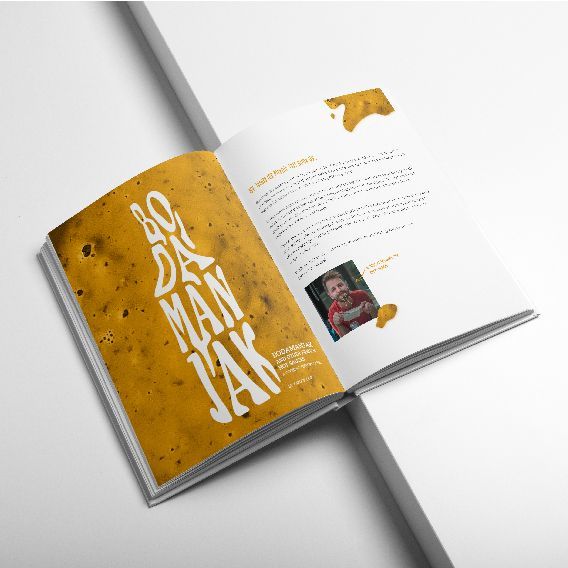 A Book is Open to a Page That Says Bo Da Man Jak — Brindabella Print In Tuggeranong, ACT