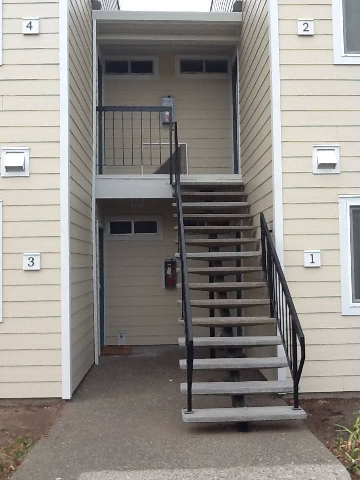 a set of stairs leading up to the second floor of a building