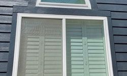 a window with shutters on it.