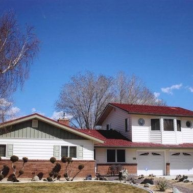 a white house with a red roof.