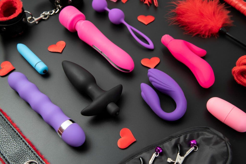 Sex toys on a black table
