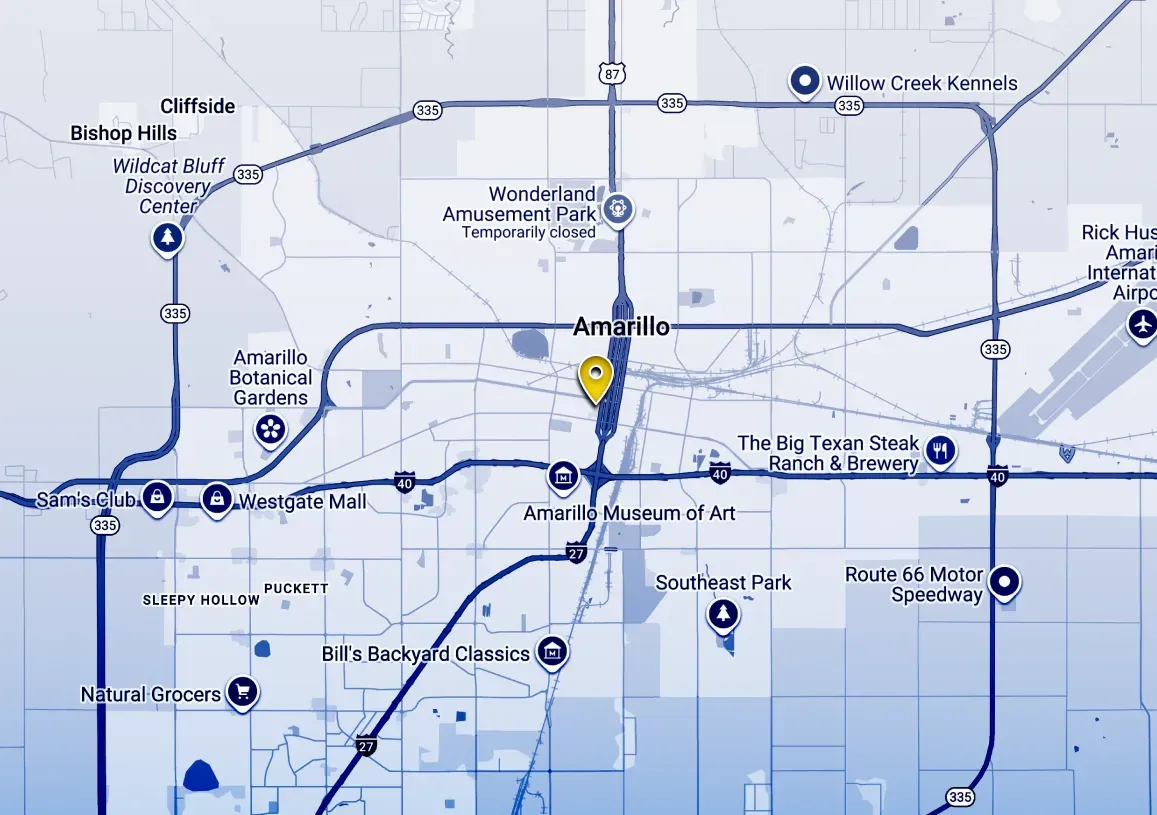 Blue-toned map with roads and route markers, centered on a highlighted location pin.