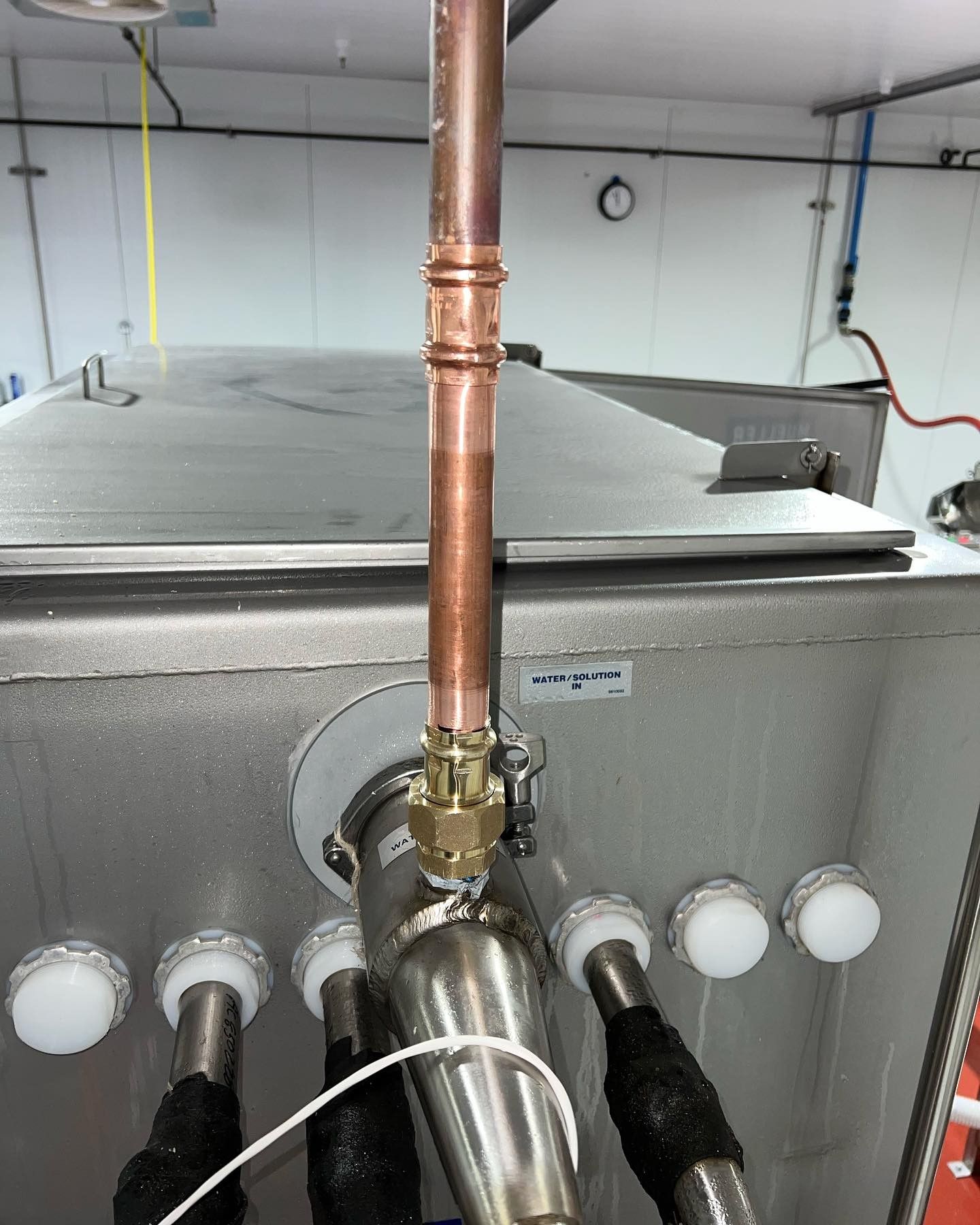 Industrial plumbing with gas line and copper pipe installation for mechanical system
