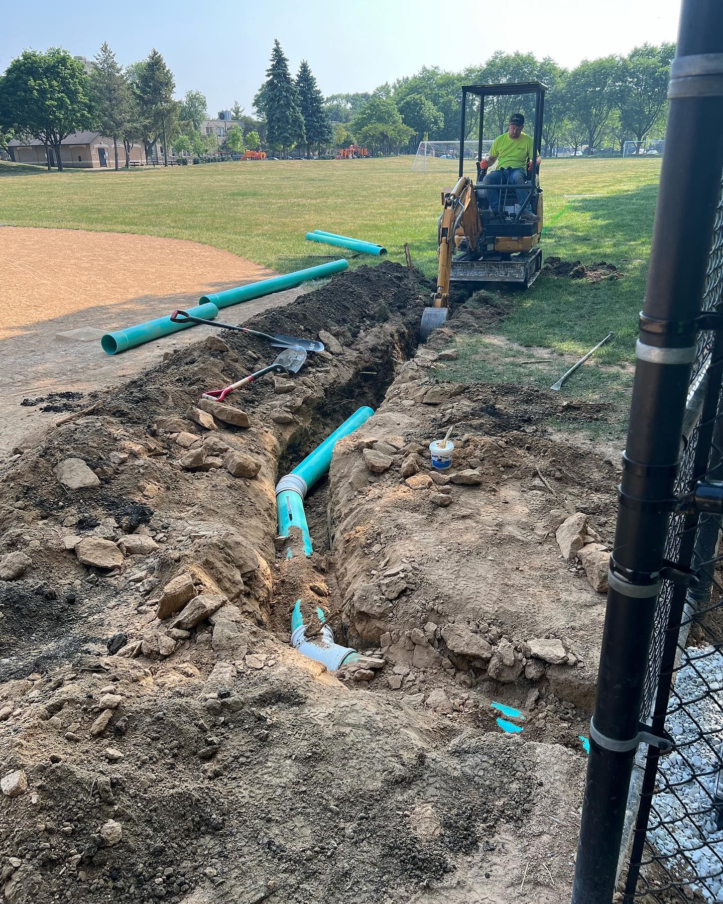 Sewer line installation at commercial property with trenching and pipe replacement
