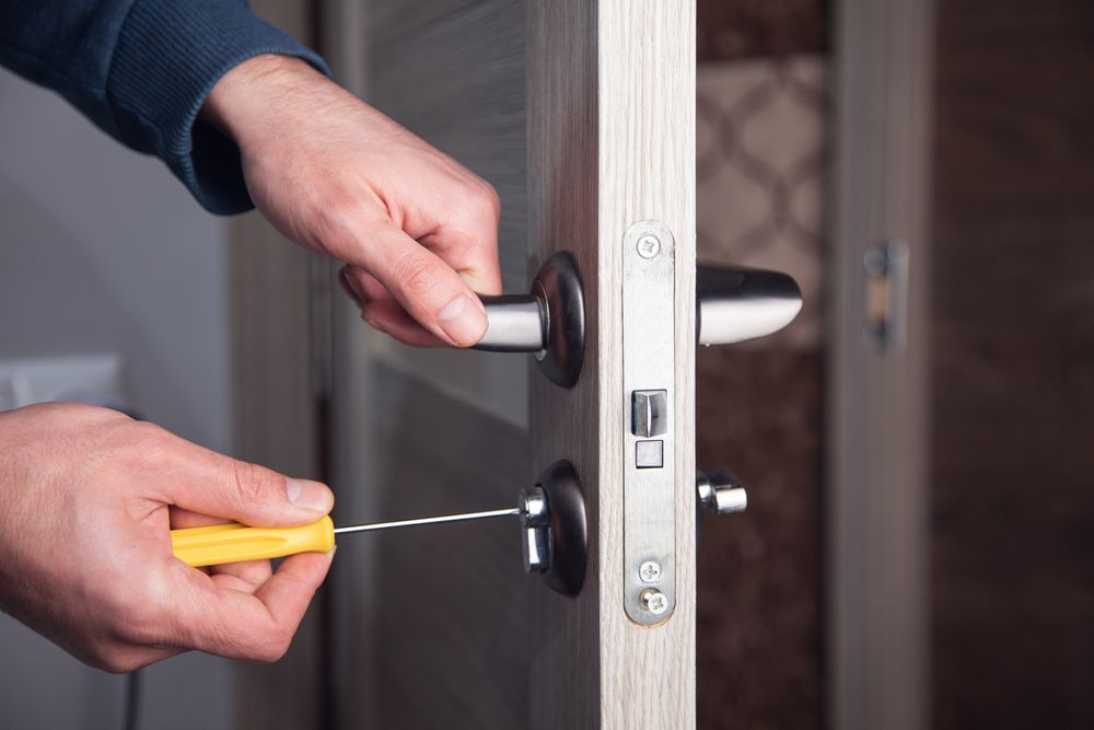 A Door Handle On A Wooden Door — Fortress Locksmiths & Security in St Ives, NSW
