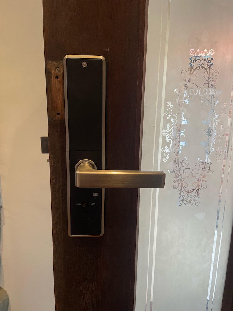 A Door With A Door Handle — Fortress Locksmiths & Security in Hornsby, NSW
