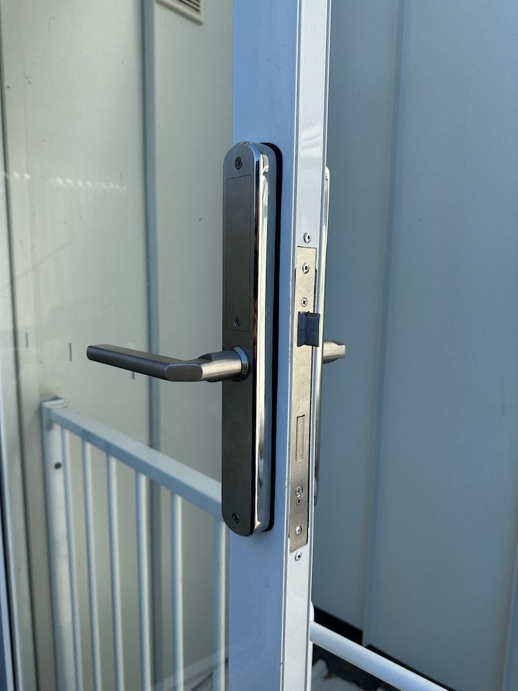 A Door With A Handle On It — Fortress Locksmiths & Security in Hornsby, NSW