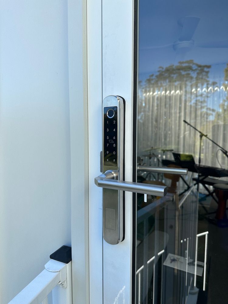 A Door With A Digital Lock On It — Fortress Locksmiths & Security in West Pennant Hills, NSW
