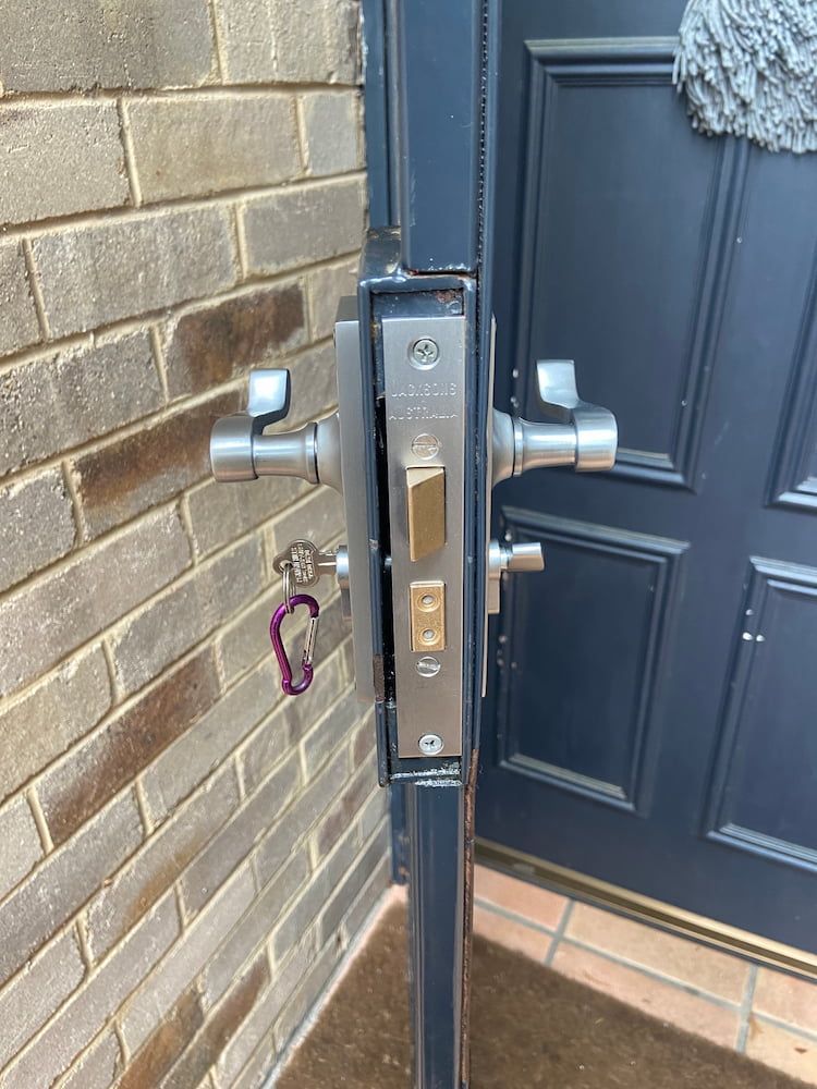 A Door Lock On A Brick Wall — Fortress Locksmiths & Security in St Ives, NSW