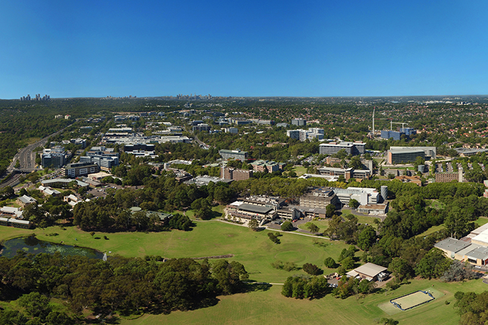 An Aerial View Of A Small Town Surrounded By Trees And A River — Fortress Locksmiths & Security in North Ryde, NSW