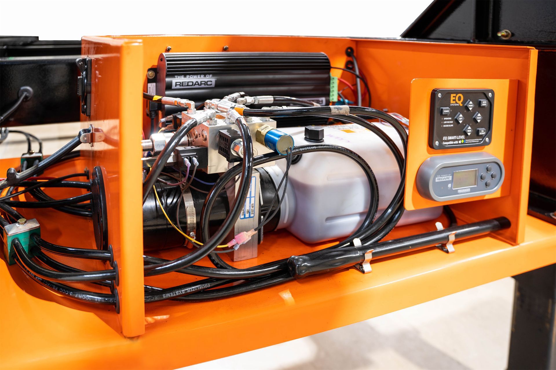 a close up of the hydraulics of the Container Leveling Chassis Trailer