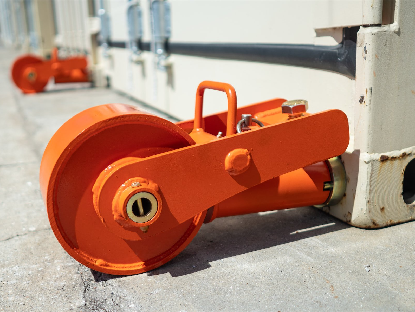 a close up of a wheel on a container on the ground .