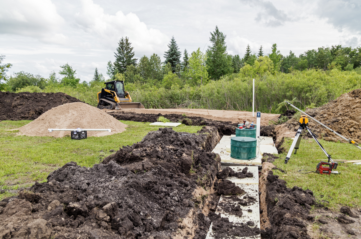 a construction site with a bulldozer in the background