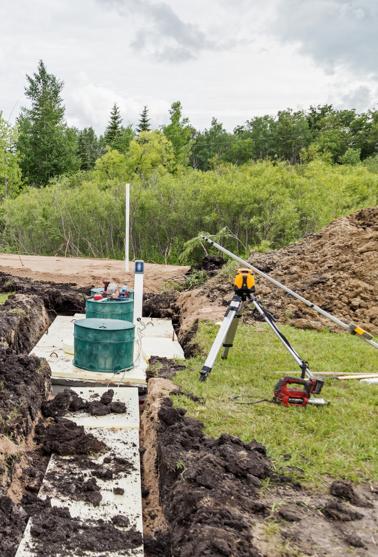 a septic tank is being built in the dirt